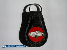 Mazda MX-5 NA Schlüsselanhänger aus Leder in Weiss – mit MX-5 NA Abbildung, kompaktes Accessoire.
